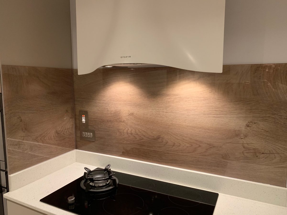 Wood effect printed splashbacks to match breakfast bar Glass Republic